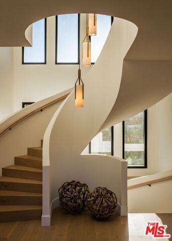 a view of an empty room with a staircase