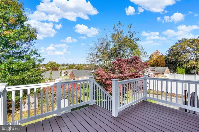 a view of a balcony with wooden floor