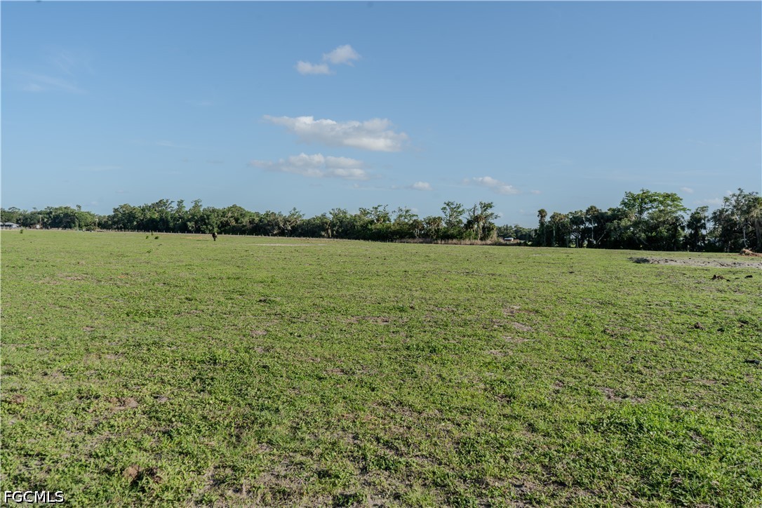 515 Norris Road Fort Denaud, FL 33935 - Photo 11 of 13 a view of a lake with houses in the back