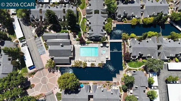 an aerial view of a houses with outdoor space