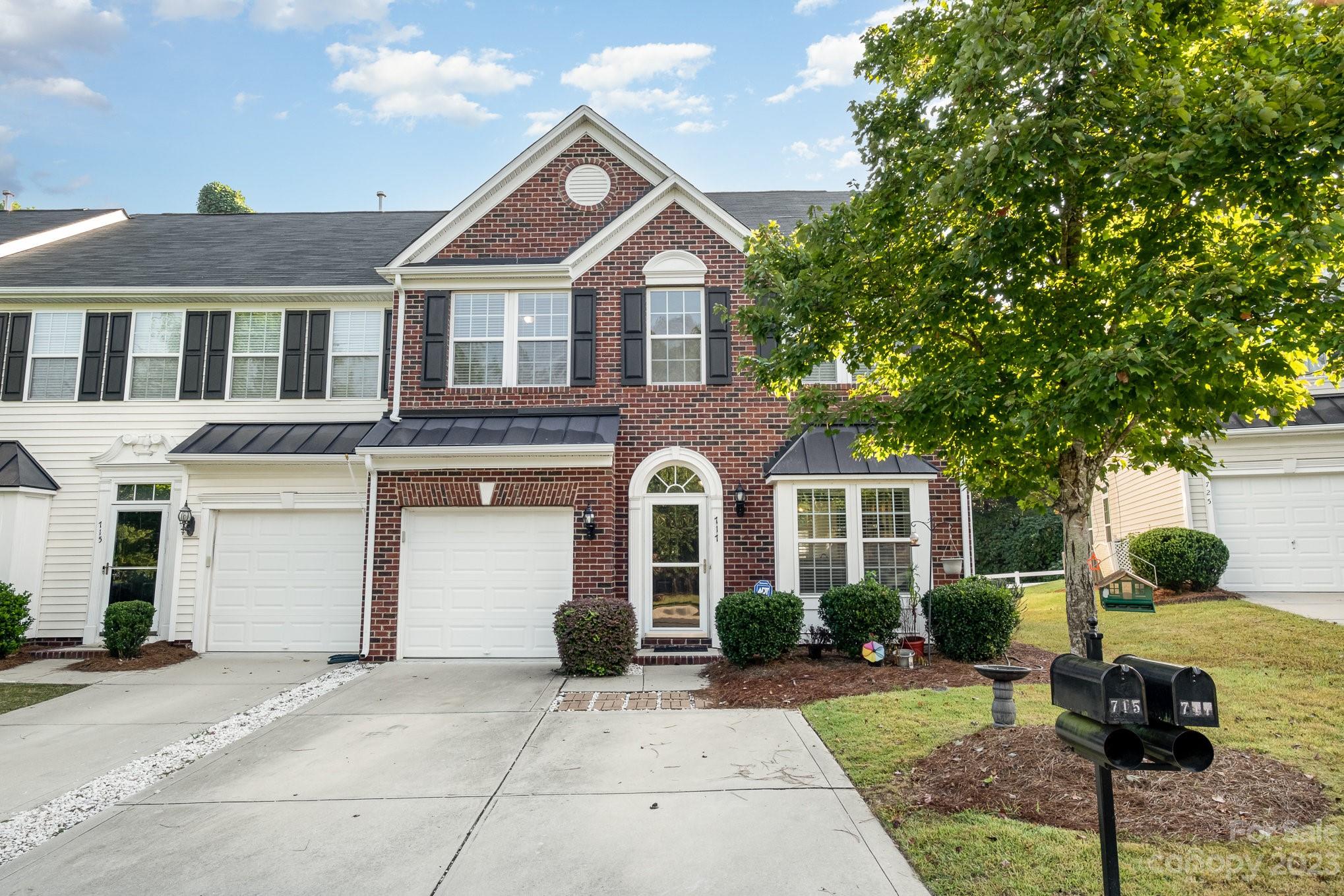 717 Prospect Lane Fort Mill, SC 29708 - Photo 1 of 21 a front view of a house with garden
