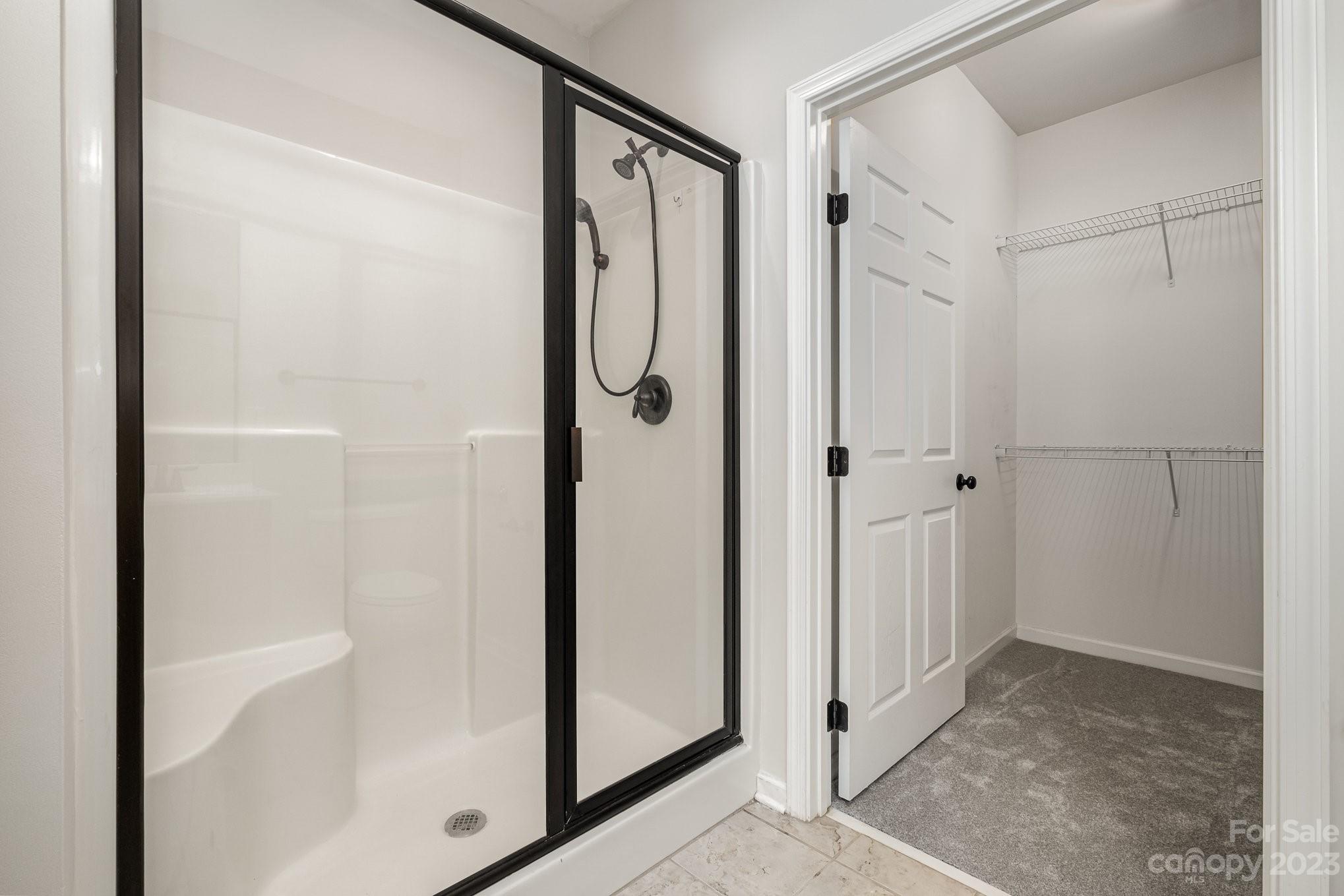 717 Prospect Lane Fort Mill, SC 29708 - Photo 13 of 21 a bathroom with a glass shower door