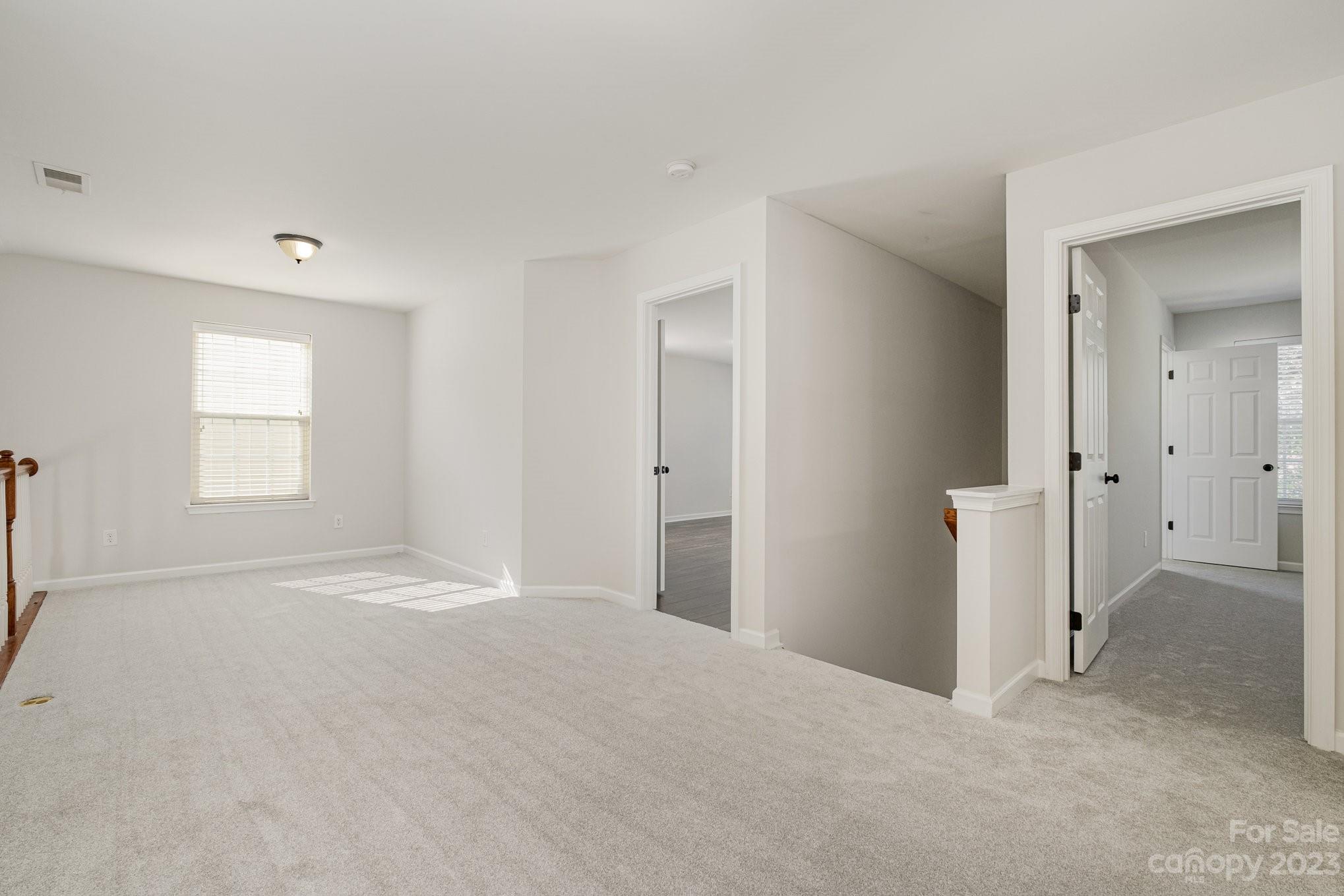 717 Prospect Lane Fort Mill, SC 29708 - Photo 15 of 21 an empty room with windows and closet