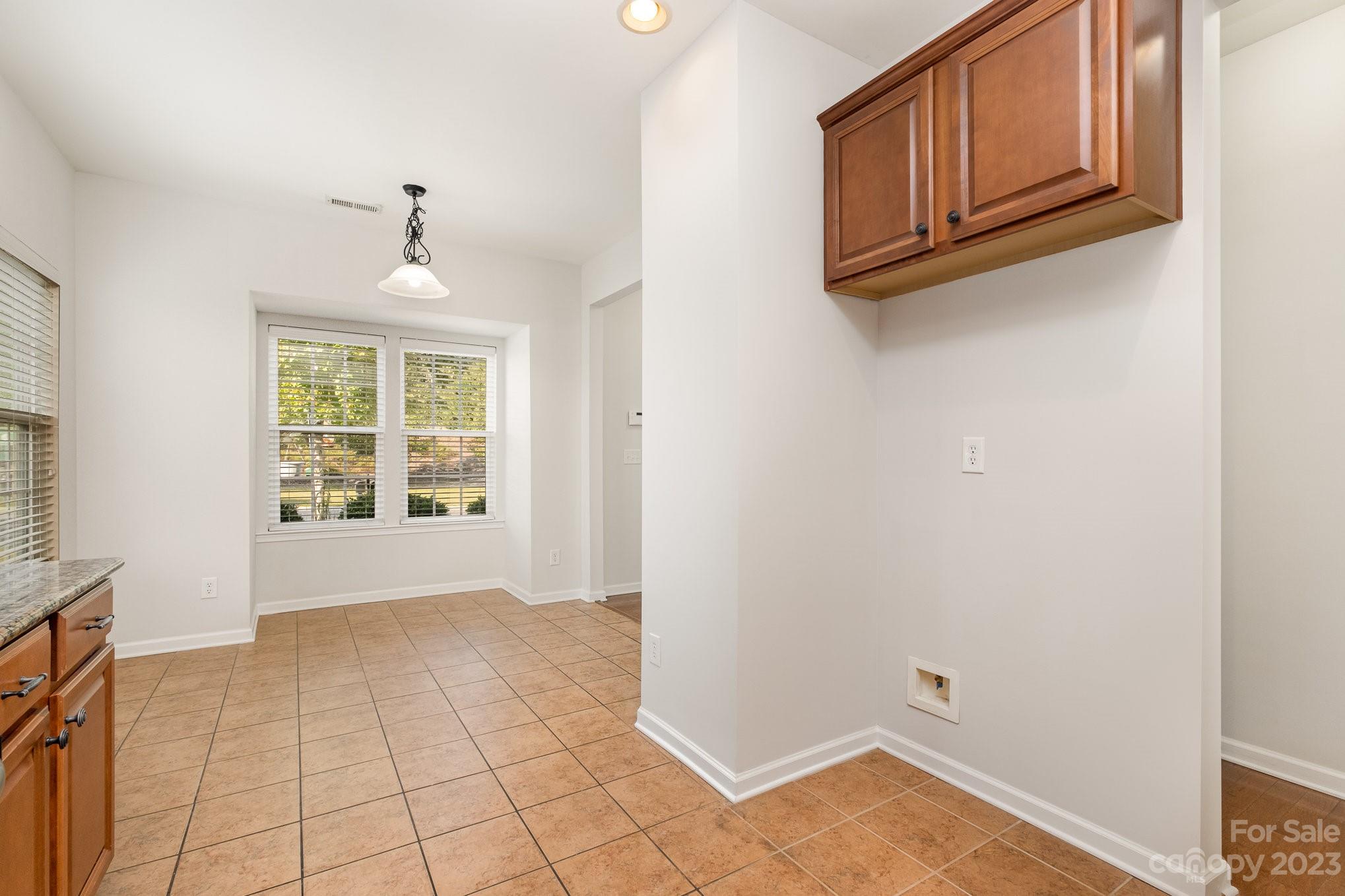 717 Prospect Lane Fort Mill, SC 29708 - Photo 6 of 21 a view of an empty room with window and cabinet