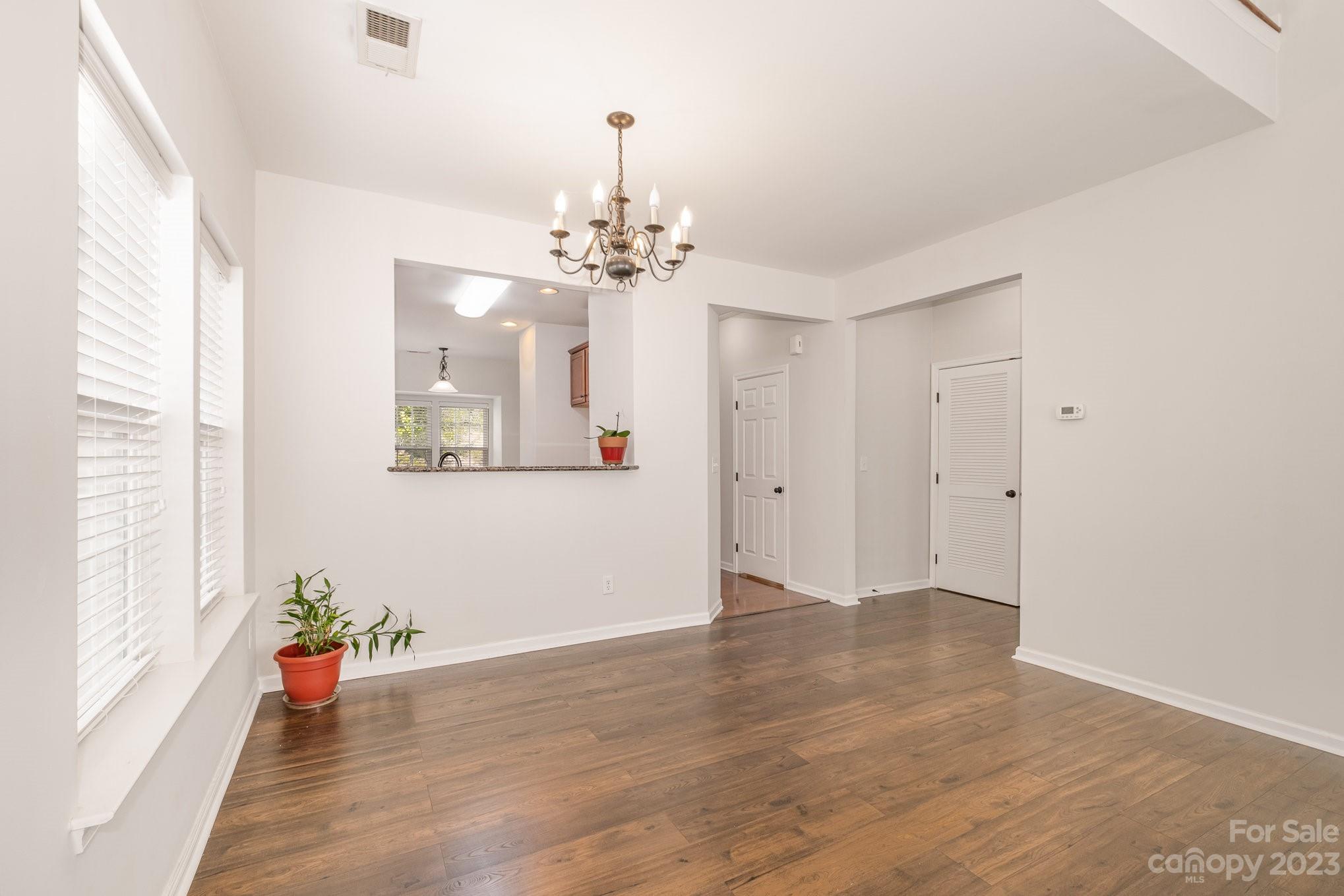 717 Prospect Lane Fort Mill, SC 29708 - Photo 8 of 21 a view of an empty room with wooden floor and a window