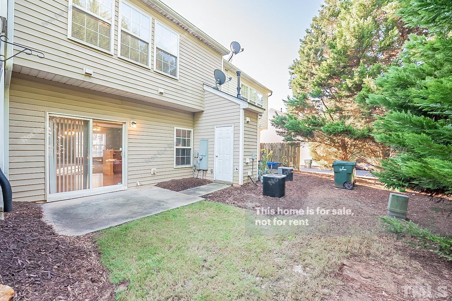 8303 Clasara Circle Raleigh, NC 27613 - Photo 5 of 17 a view of a house with backyard and sitting area