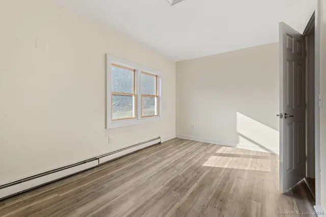 a bathroom with a sink mirror and toilet