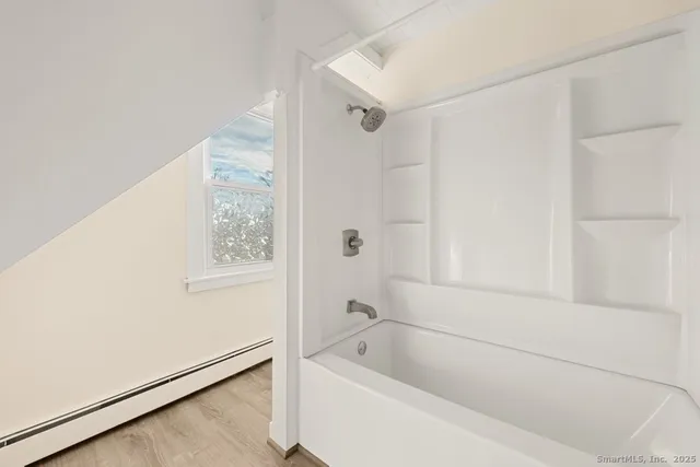 a view of a hallway with washer and dryer