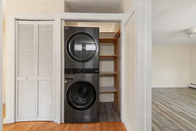 a room with a bench and wooden floor