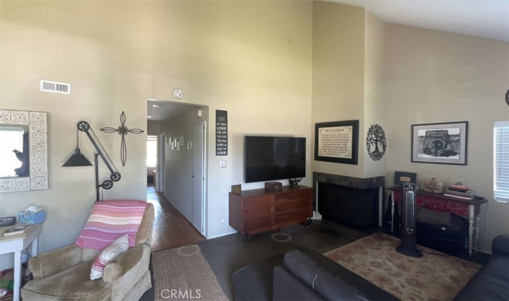 4115 East 6th Street Long Beach, CA 90814 - Photo 3 of 34 a living room with furniture and a flat screen tv