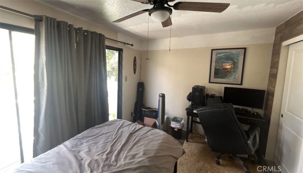 4115 East 6th Street Long Beach, CA 90814 - Photo 10 of 34 a bedroom that has a bed and a desk