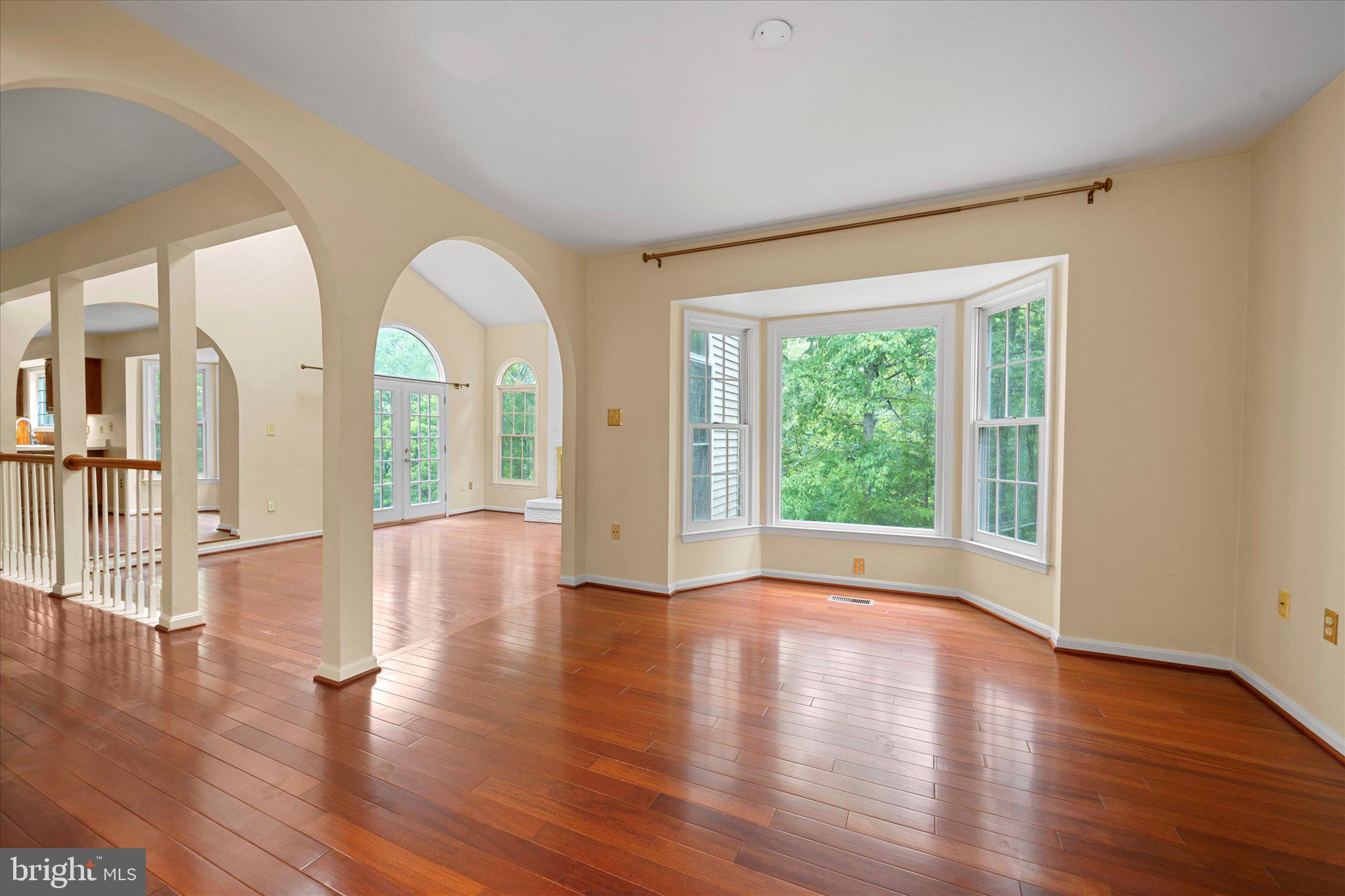 6832 Compton Heights Circle Clifton, VA 20124 - Photo 11 of 54 a view of empty room with wooden floor and fan