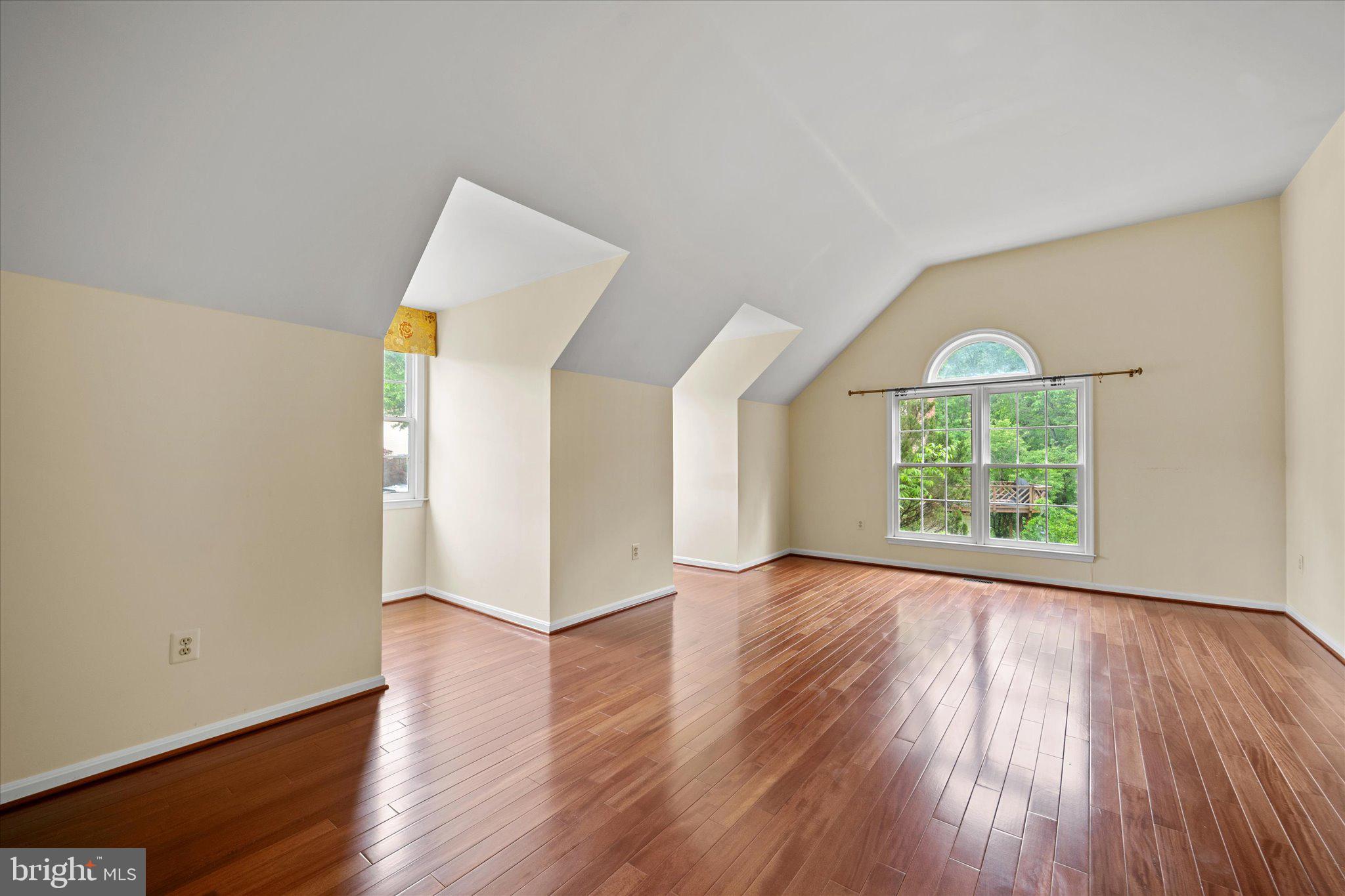 6832 Compton Heights Circle Clifton, VA 20124 - Photo 27 of 54 an empty room with wooden floor and windows