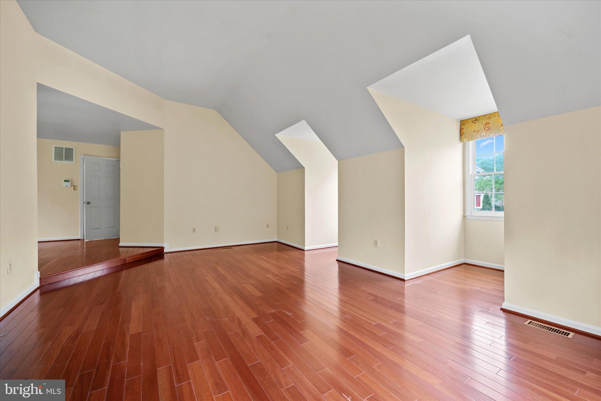 6832 Compton Heights Circle Clifton, VA 20124 - Photo 29 of 54 an empty room with wooden floor and windows