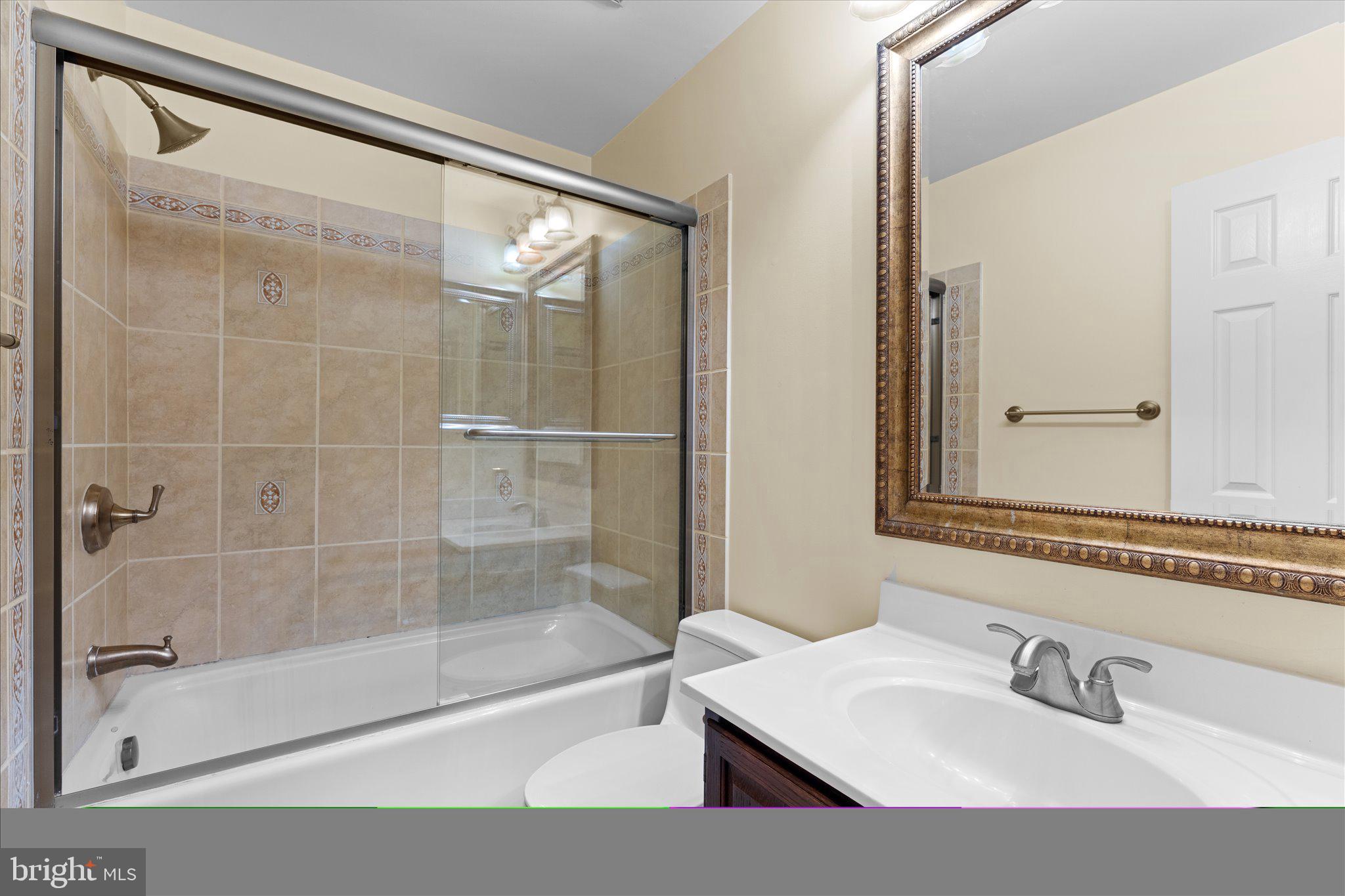 6832 Compton Heights Circle Clifton, VA 20124 - Photo 37 of 54 a bathroom with a shower and a sink