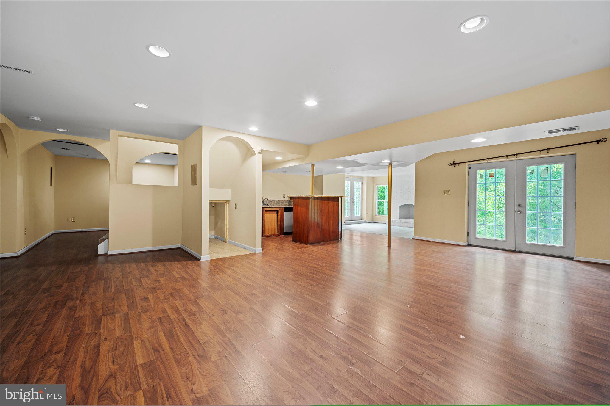 6832 Compton Heights Circle Clifton, VA 20124 - Photo 45 of 54 a view of empty room with wooden floor and windows