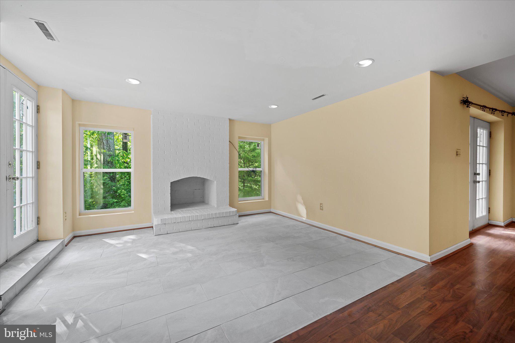 6832 Compton Heights Circle Clifton, VA 20124 - Photo 47 of 54 a view of an empty room with a window and wooden floor
