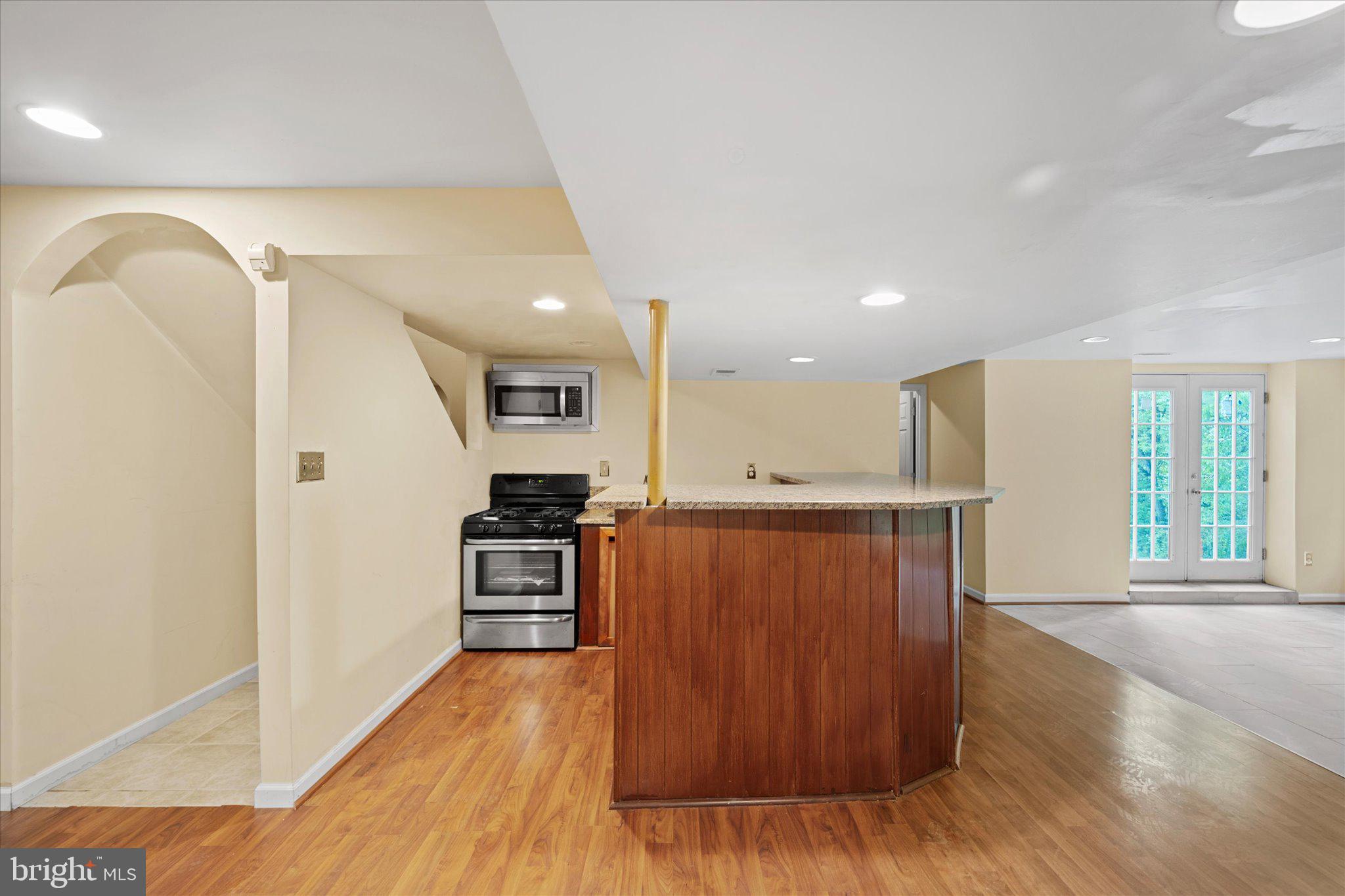 6832 Compton Heights Circle Clifton, VA 20124 - Photo 49 of 54 a view of a kitchen with a sink and a stove top oven