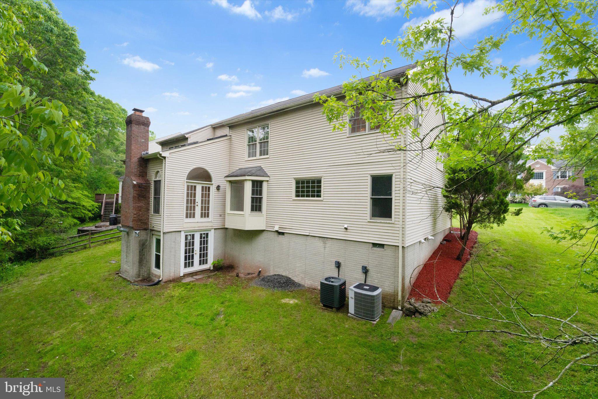 6832 Compton Heights Circle Clifton, VA 20124 - Photo 51 of 54 a view of a house with a backyard