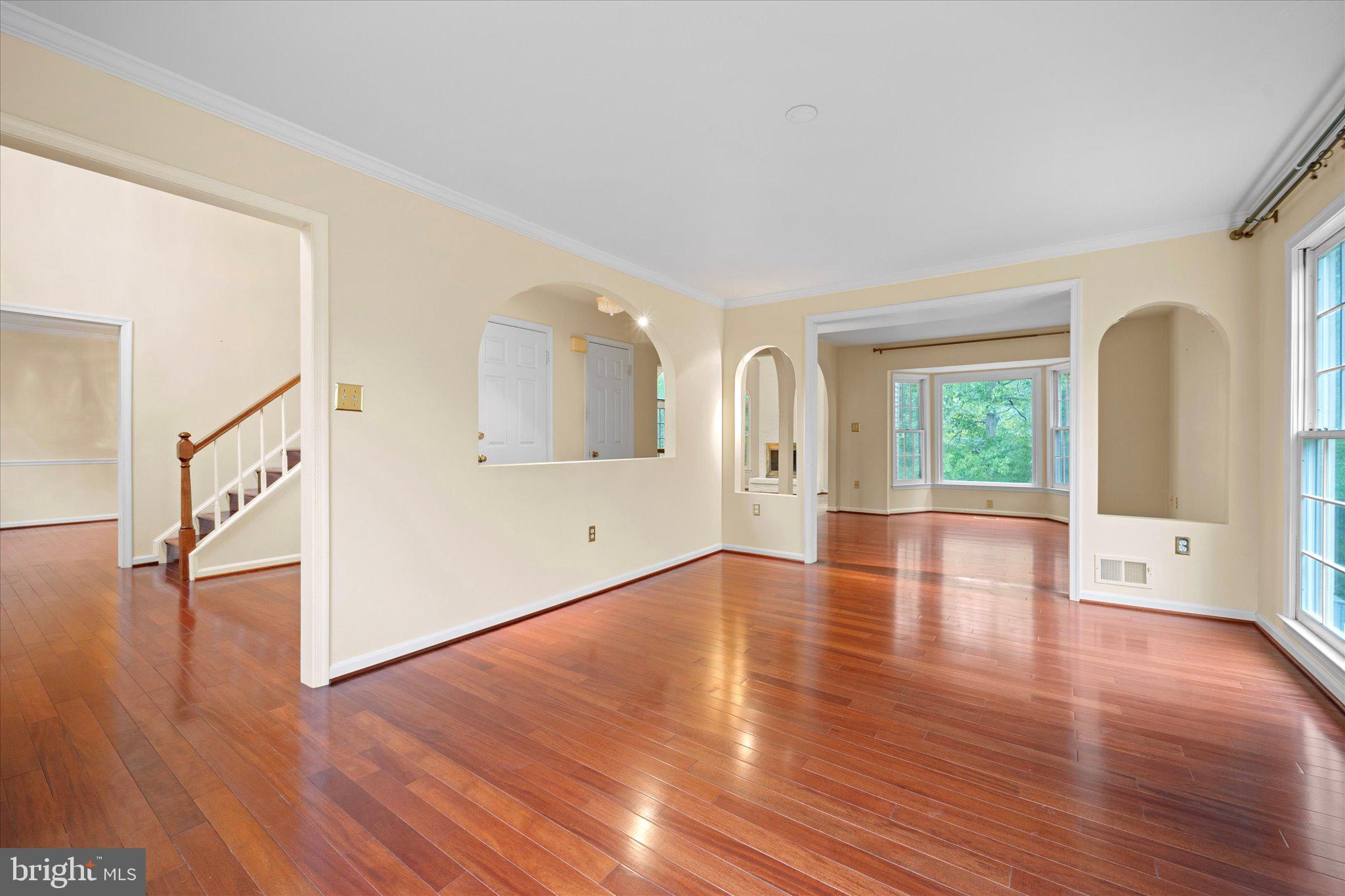 6832 Compton Heights Circle Clifton, VA 20124 - Photo 9 of 54 a view of empty room with wooden floor and window