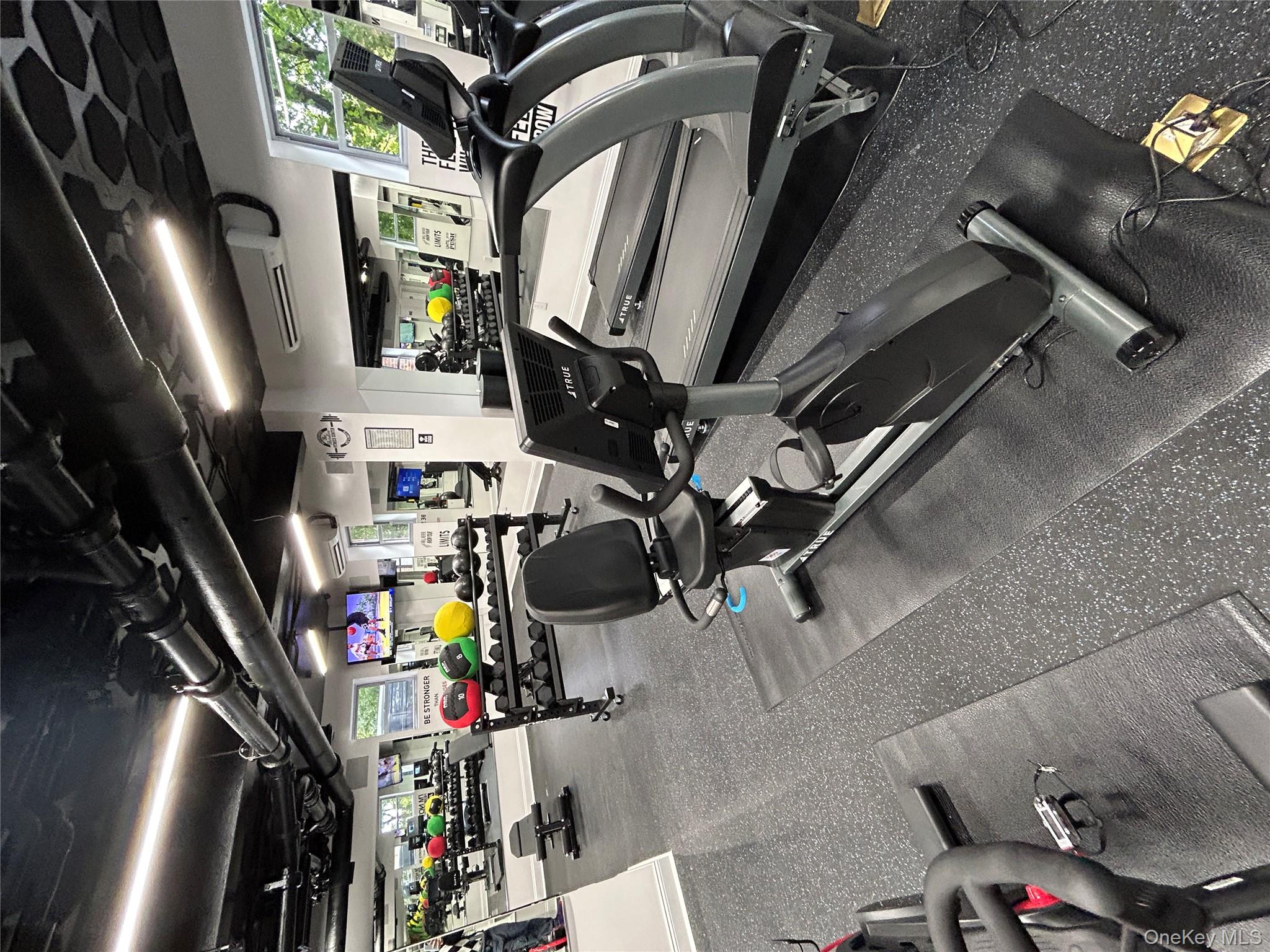 230 Pelham Road, Unit 2E New Rochelle, NY 10805 - Photo 16 of 31 Exercise room with a wall mounted air conditioner