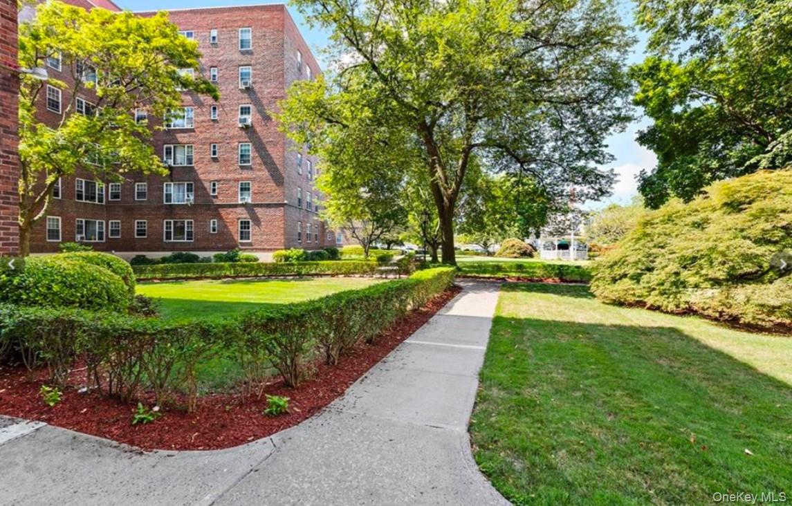 230 Pelham Road, Unit 2E New Rochelle, NY 10805 - Photo 28 of 31 View of home's community featuring a lawn