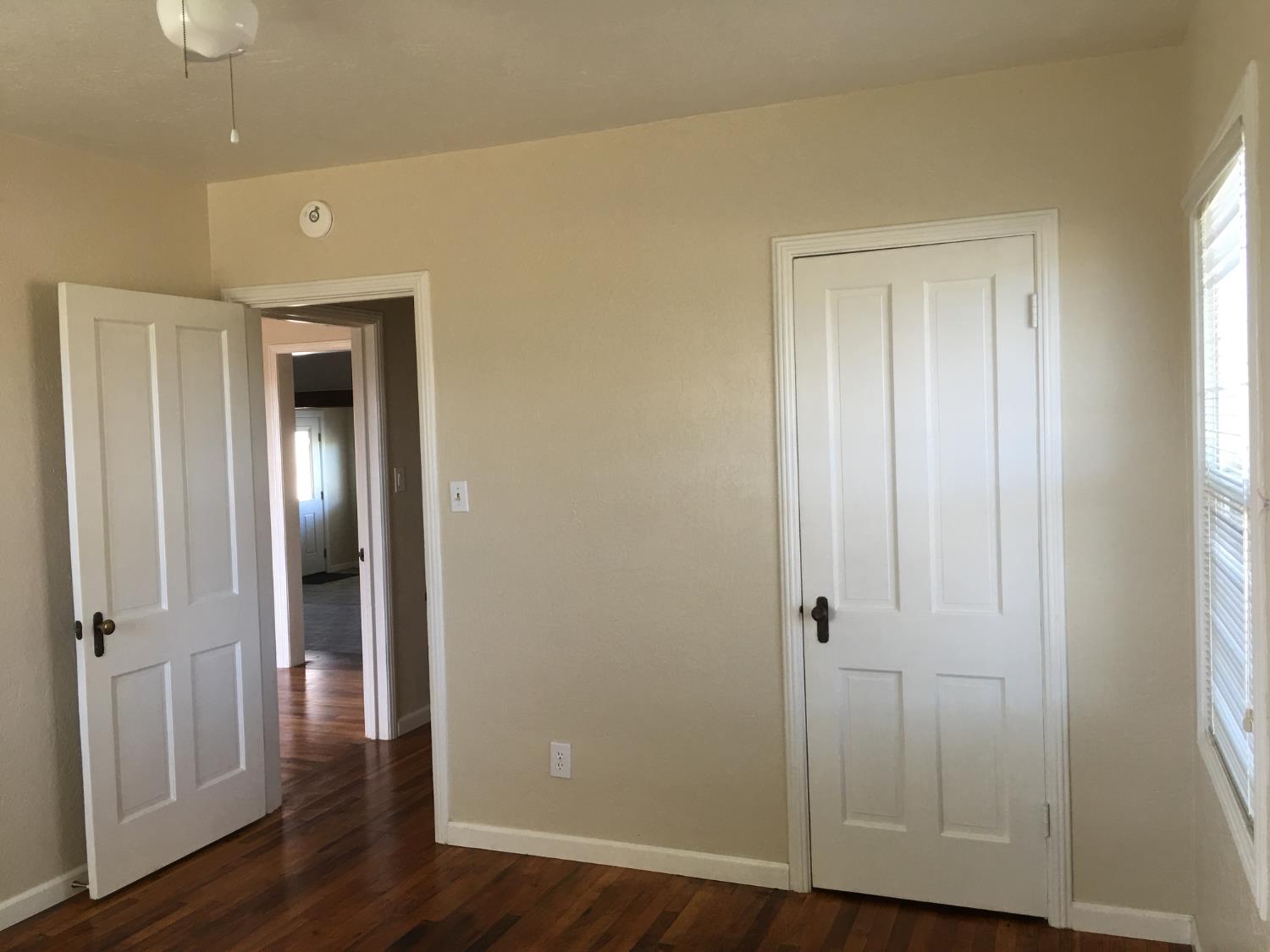 1237 West Keyes Road Modesto, CA 95358 - Photo 12 of 16 a view of a hallway with wooden floor
