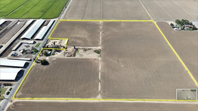 a room with water heater and a wooden floor