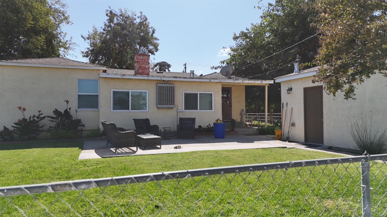 1237 West Keyes Road Modesto, CA 95358 - Photo 7 of 16 a front view of house with yard and outdoor seating