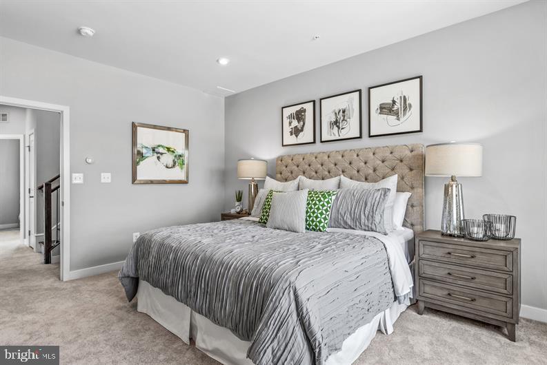 Kloman Street, Unit MOZART 3 Baltimore, MD 21230 - Photo 12 of 27 a bedroom with a bed and painting on the wall