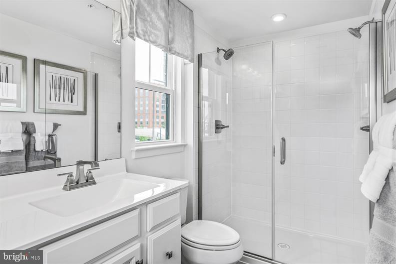 Kloman Street, Unit MOZART 3 Baltimore, MD 21230 - Photo 14 of 27 a bathroom with a sink toilet vanity and shower