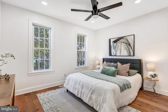 a bedroom with a large bed and a window