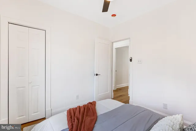 a bedroom with a bed and a closet