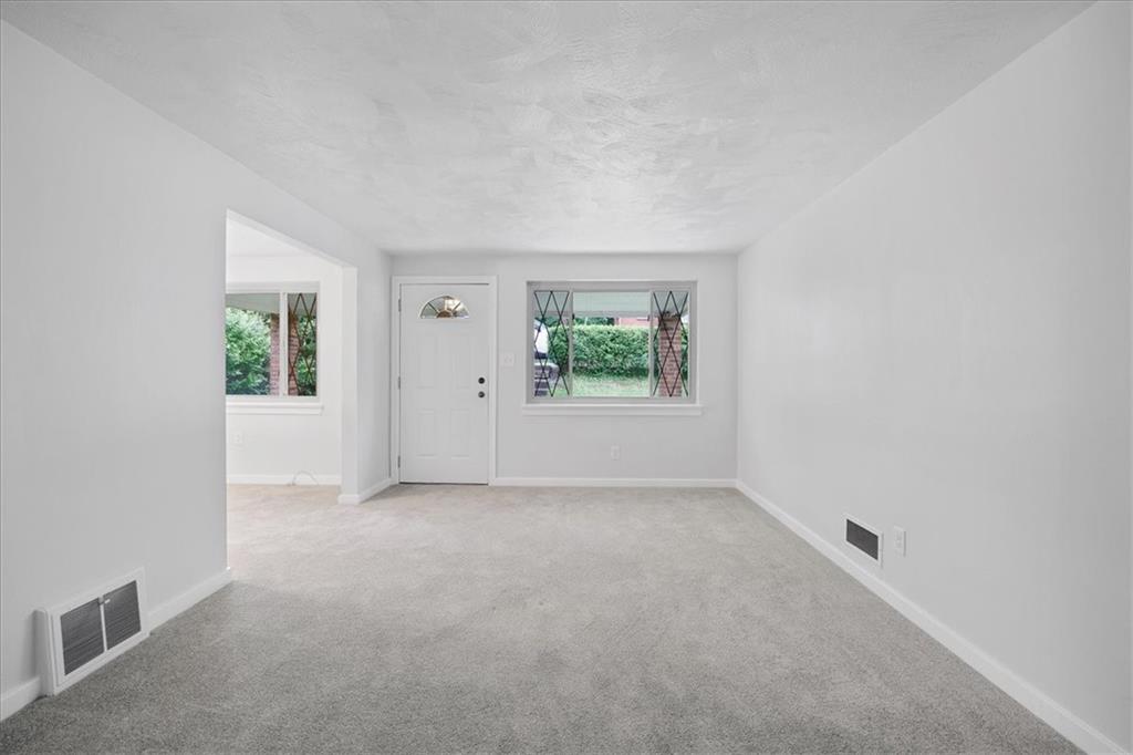 620 Beulah Road Pittsburgh, PA 15235 - Photo 2 of 25 an empty room with windows