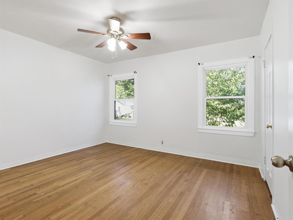 3804 Pershing Avenue Fort Worth, TX 76107 - Photo 16 of 31 wooden floor in an empty room with a window