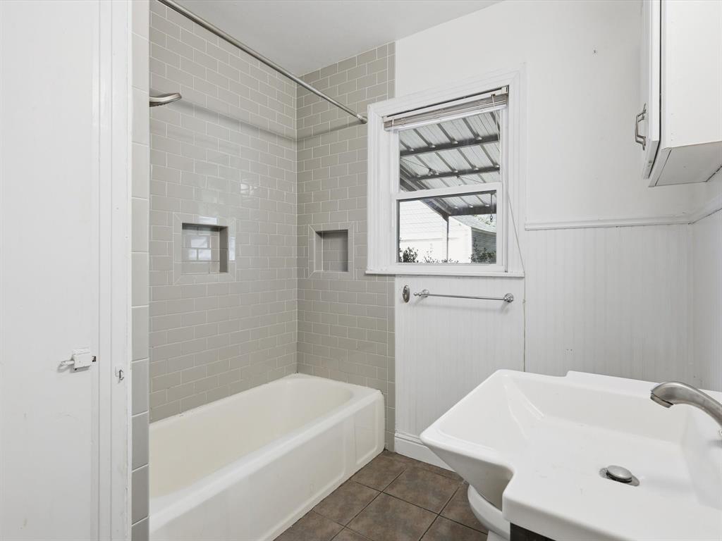3804 Pershing Avenue Fort Worth, TX 76107 - Photo 17 of 31 a bathroom with a sink and a bathtub