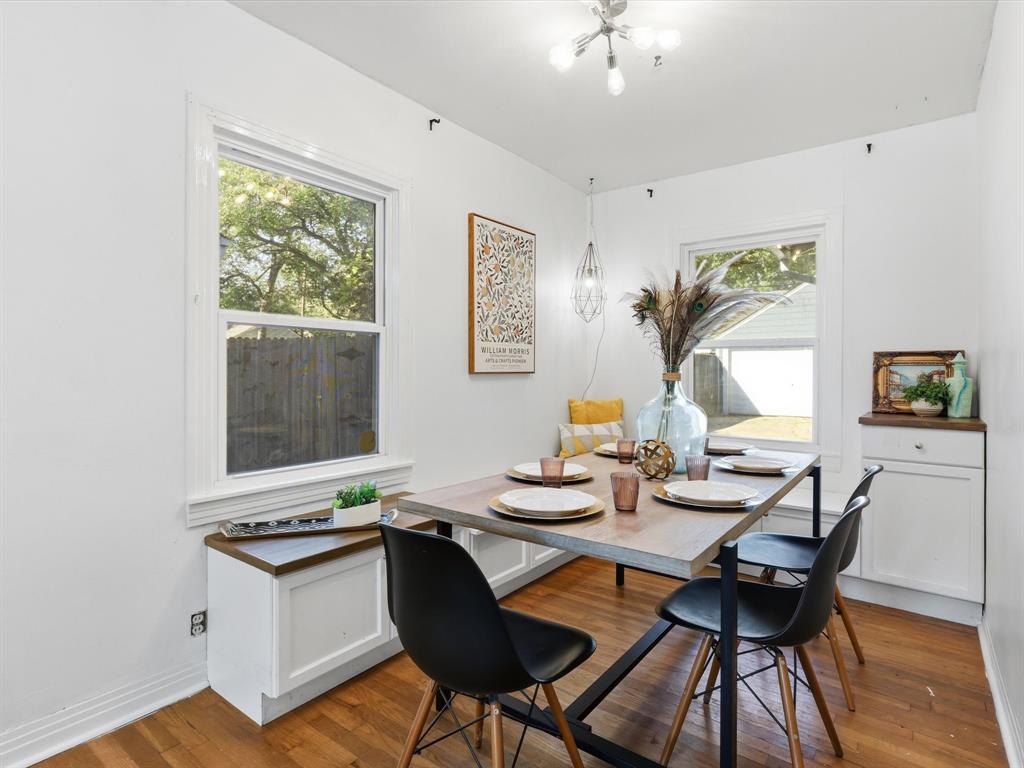 3804 Pershing Avenue Fort Worth, TX 76107 - Photo 7 of 31 a view of a dining room with furniture window and wooden floor