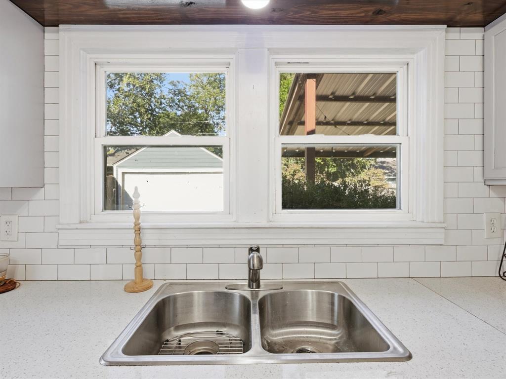 3804 Pershing Avenue Fort Worth, TX 76107 - Photo 8 of 31 a kitchen sink with wooden floor