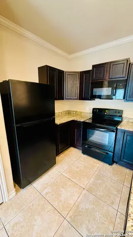 a kitchen with a sink and a stove