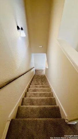 an empty room with a empty space and windows