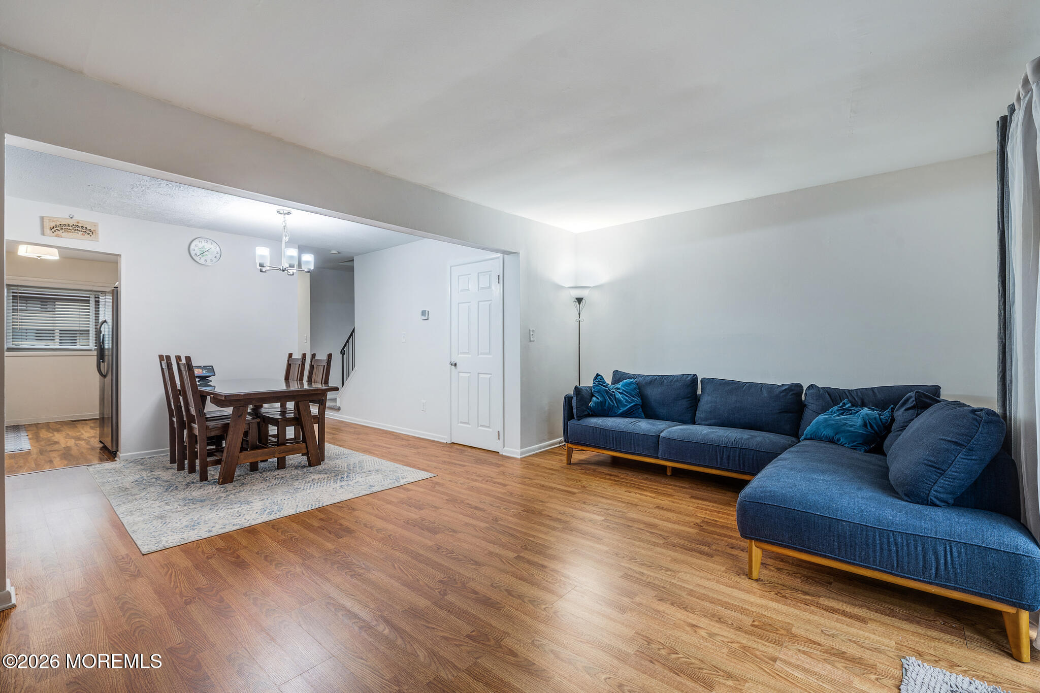 433 Bolton Road East Windsor, NJ 08520 - Photo 5 of 13 a living room with furniture and a dining table with kitchen view