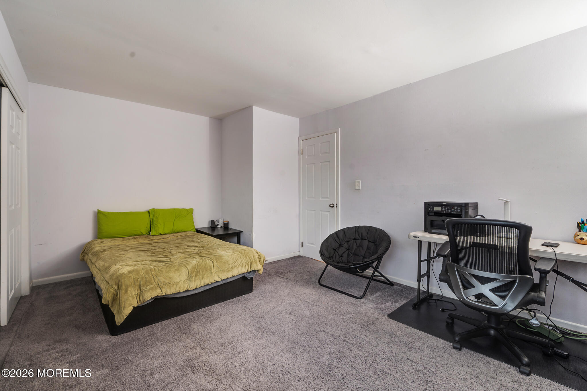 433 Bolton Road East Windsor, NJ 08520 - Photo 9 of 13 a bedroom with a bed a desk and chair