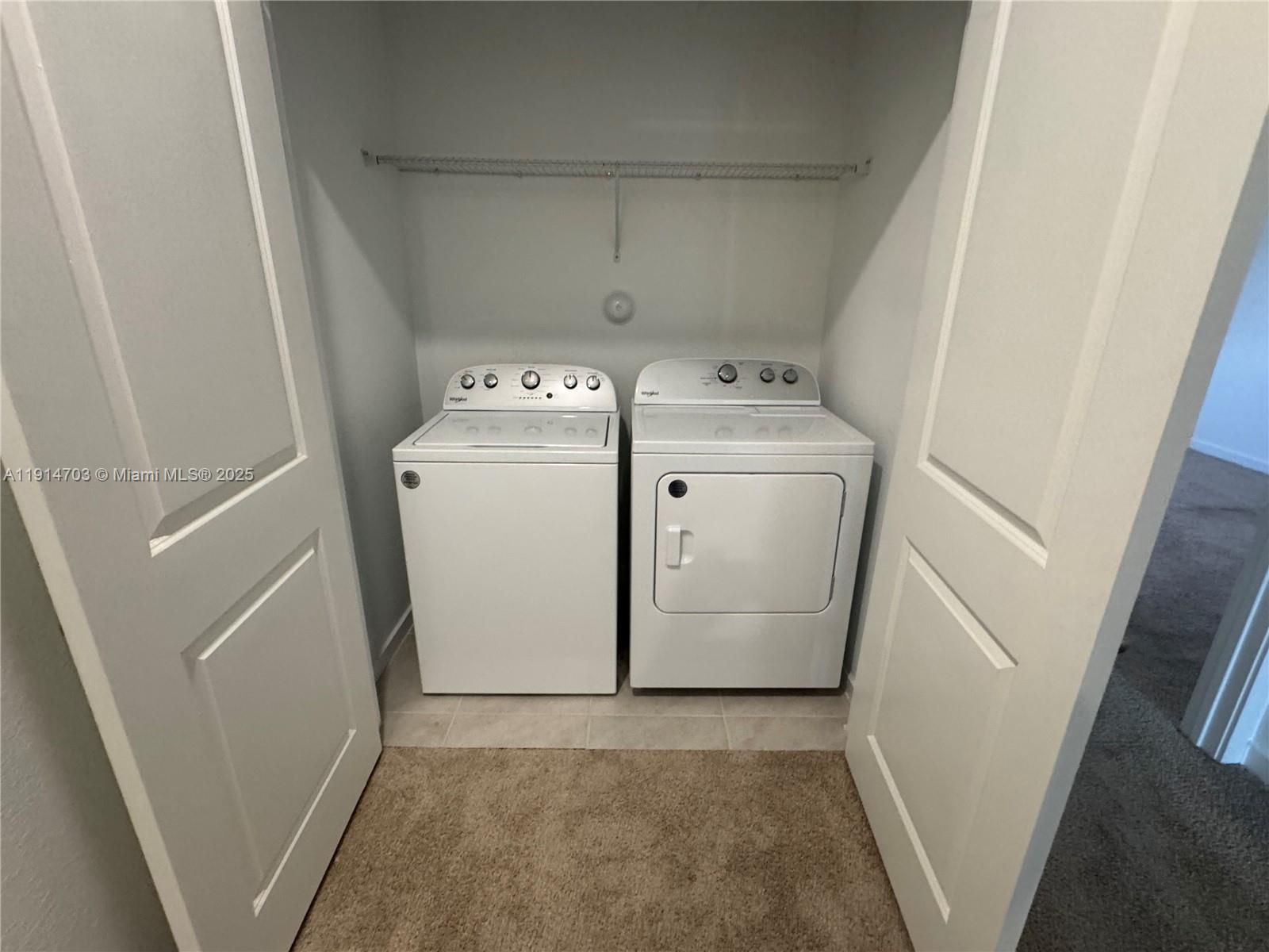 817 Northwest 3rd Way, Unit 817 Pompano Beach, FL 33060 - Photo 13 of 13 a utility room with dryer and washer