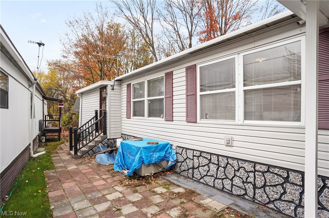 418 East Caston Road, Unit C1 Akron, OH 44319 - Photo 16 of 20 View of home's exterior featuring a patio area