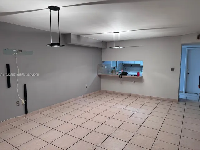 a view of a room with a large window