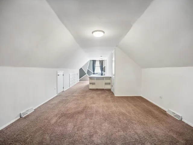 a view of an empty room with stairs