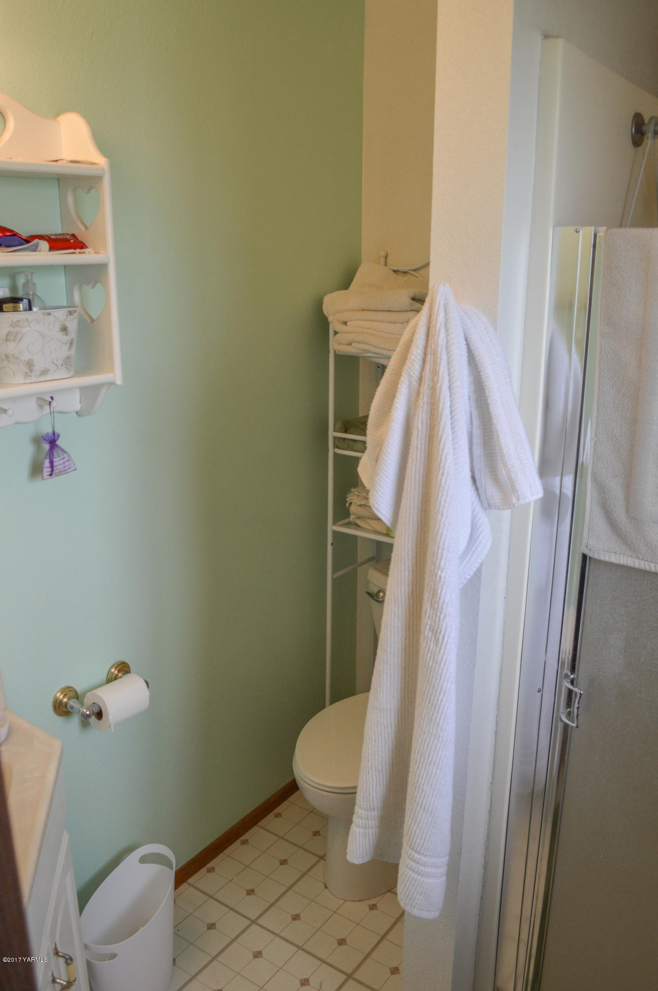 581 Gilbert Road Zillah, WA 98953 - Photo 12 of 38 a white toilet sitting next to a sink and toilet