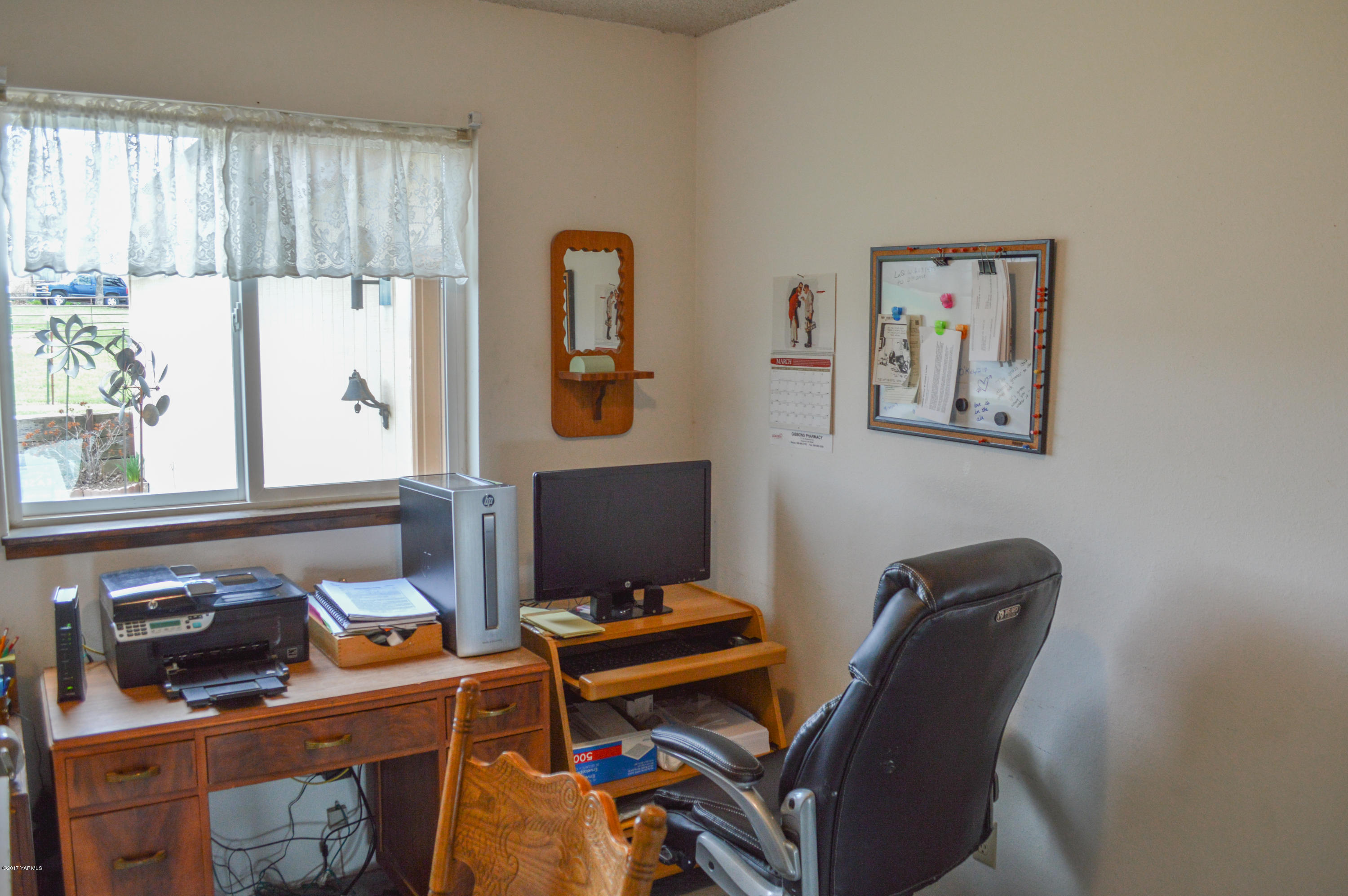 581 Gilbert Road Zillah, WA 98953 - Photo 17 of 38 a view of a workspace with furniture and a window
