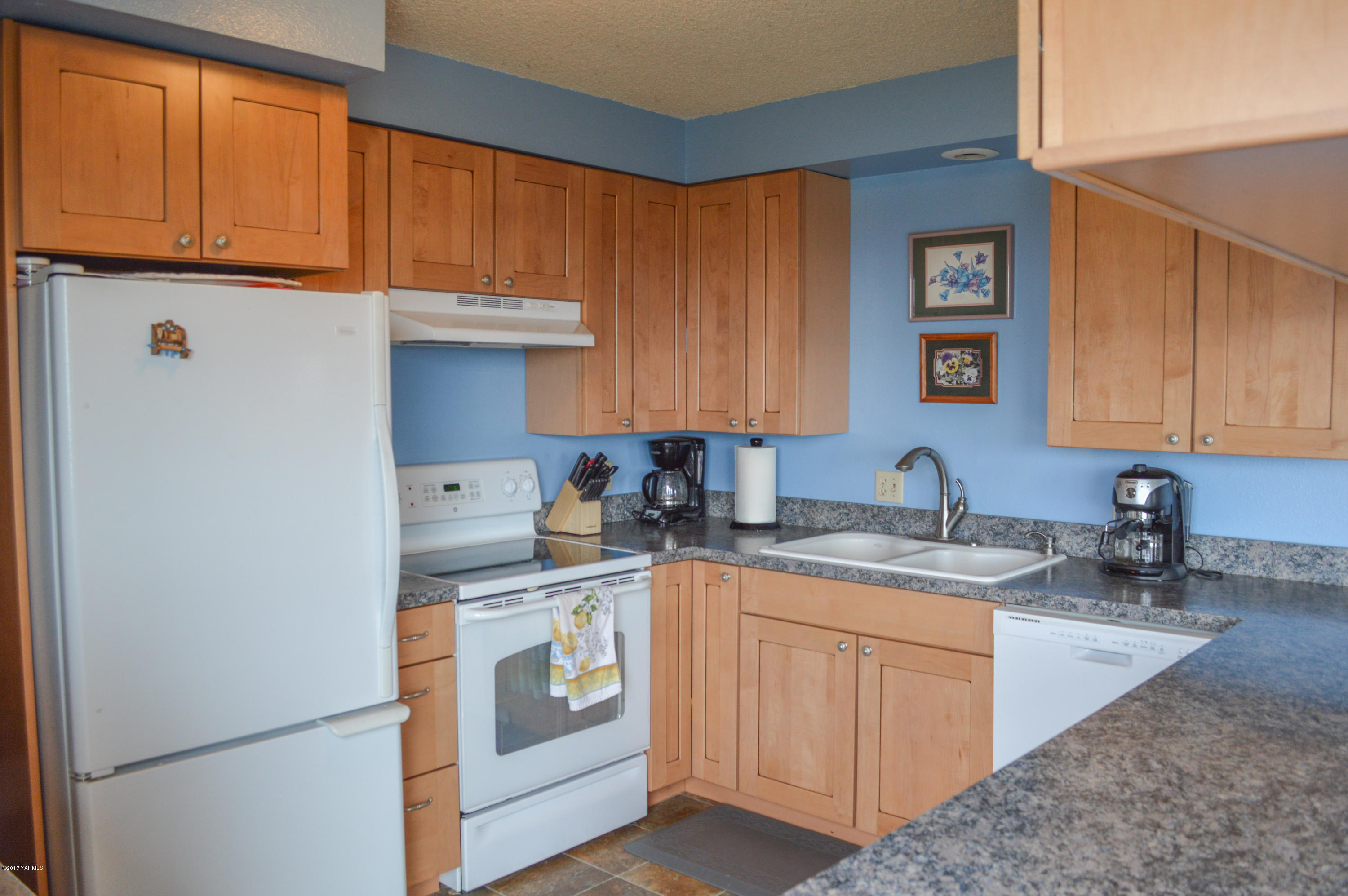 581 Gilbert Road Zillah, WA 98953 - Photo 3 of 38 a kitchen with stainless steel appliances granite countertop a sink stove and cabinets