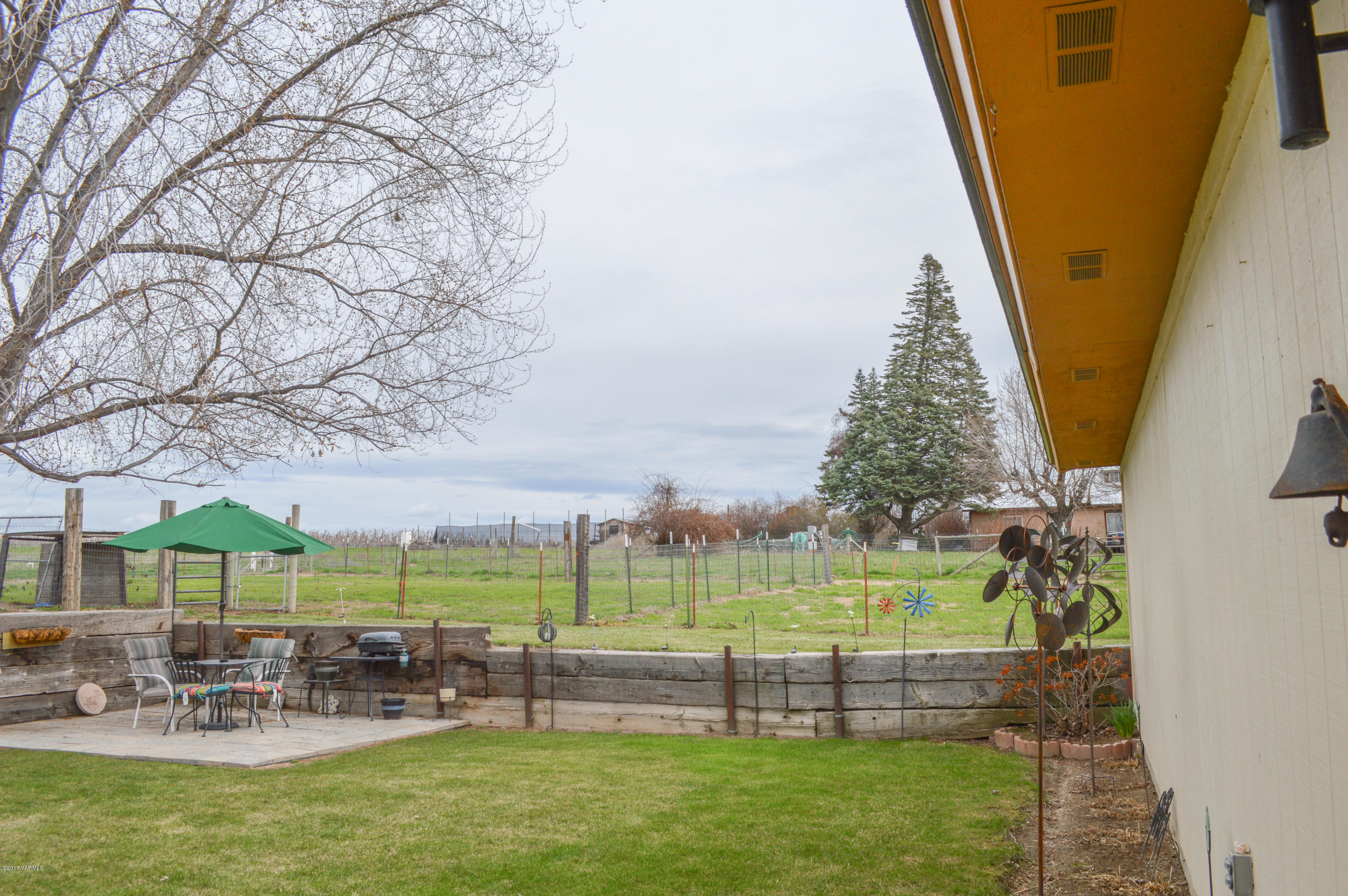 581 Gilbert Road Zillah, WA 98953 - Photo 22 of 38 a view of outdoor space with seating area and hardwood